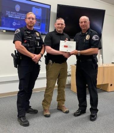 L-R, Acting Sergeant Jon Stuart, Officer Patrick Fudally, Chief Thomas Olson